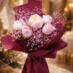 Peony and pink rose bouquet with pink baby's breath wrapped in rich burgundy paper