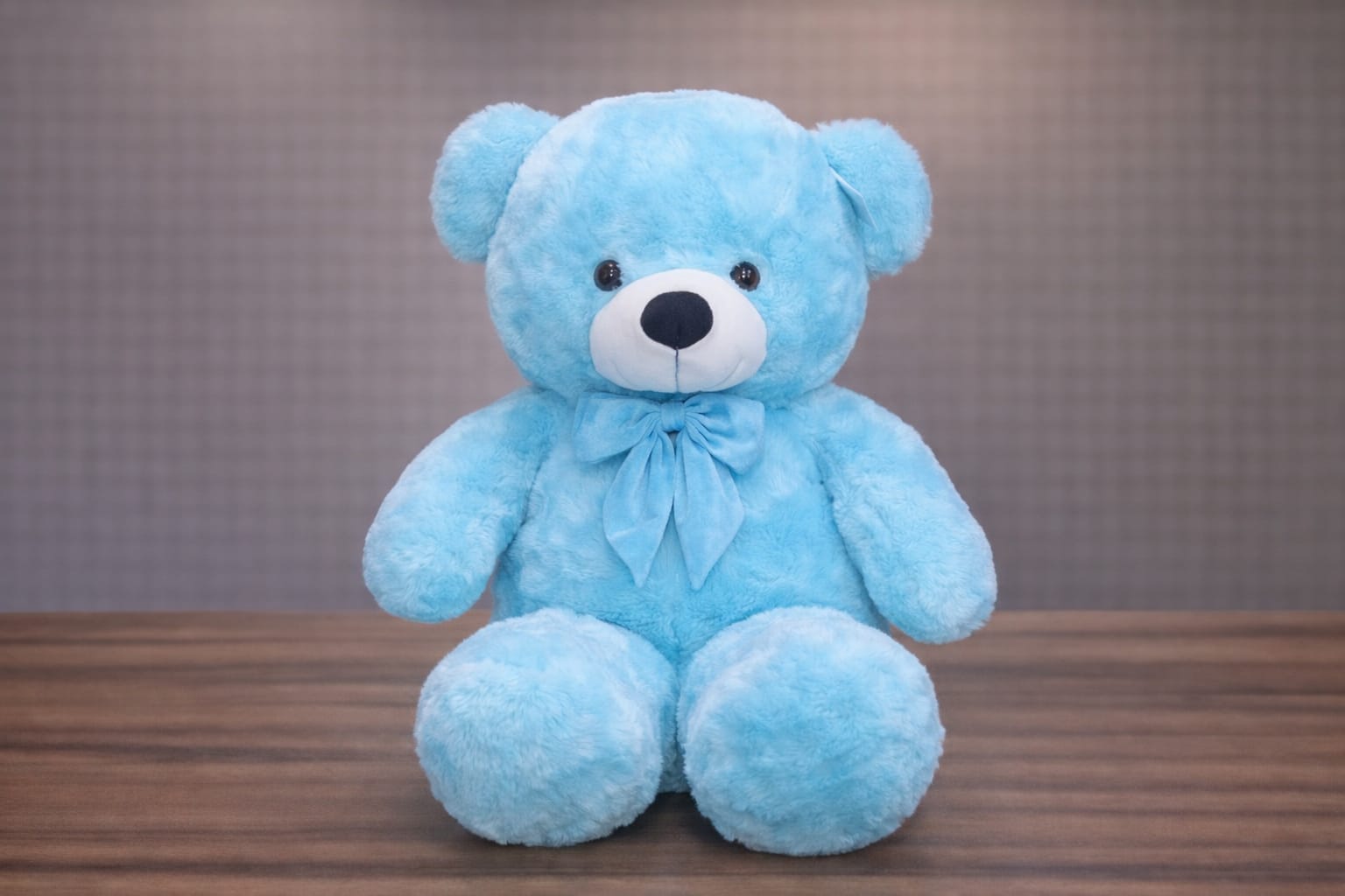 Giant sky blue plush teddy bear 1 meter tall with white muzzle and blue bow tie