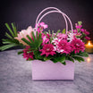 Pink handbag flower base 14 - magenta chrysanthemum and pink lily arrangement in a soft pink handbag box